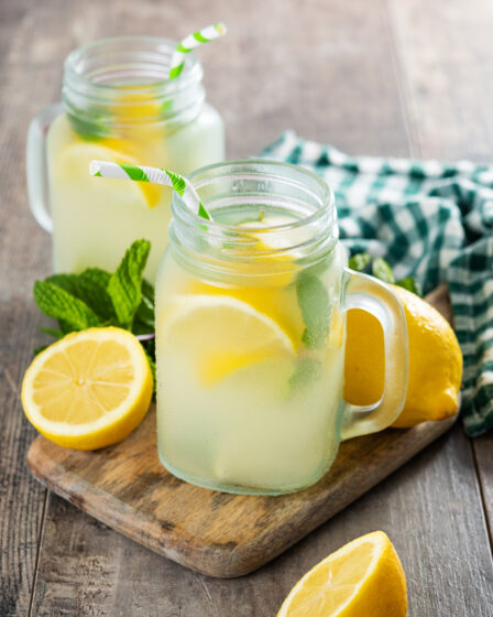 Lemonade drink in a jar glass on wooden table